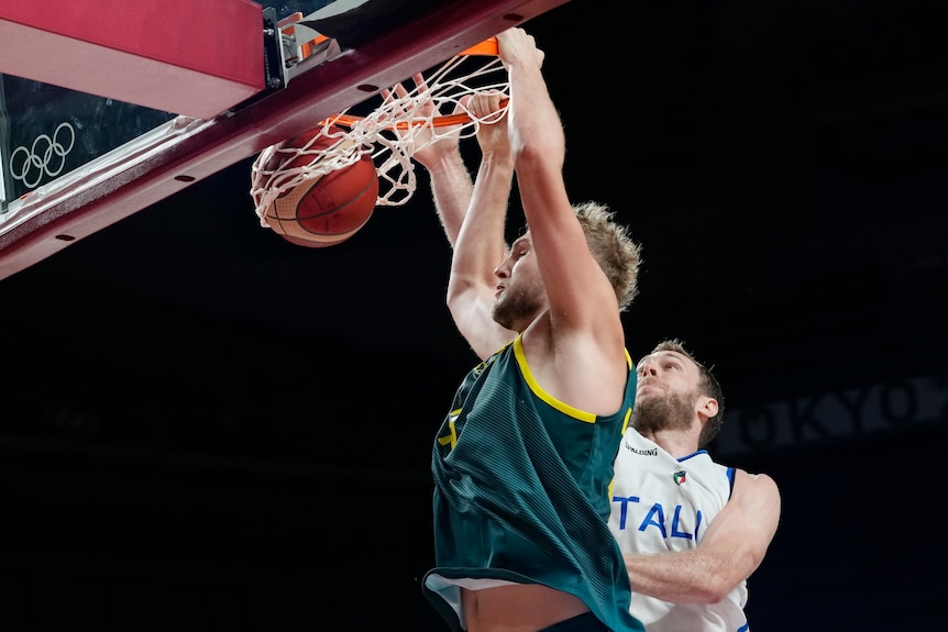 Jock Landale dunks with Nicolo Melli behind him.