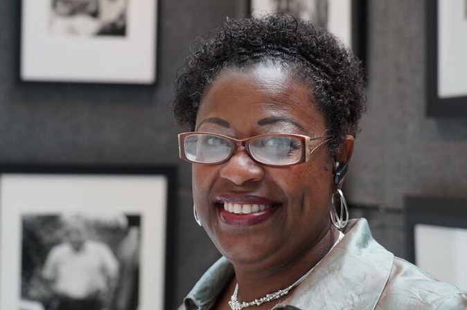 Rosalind Withers, daughter of African-America civil rights photographer Ernest Withers, smiling at the camera.