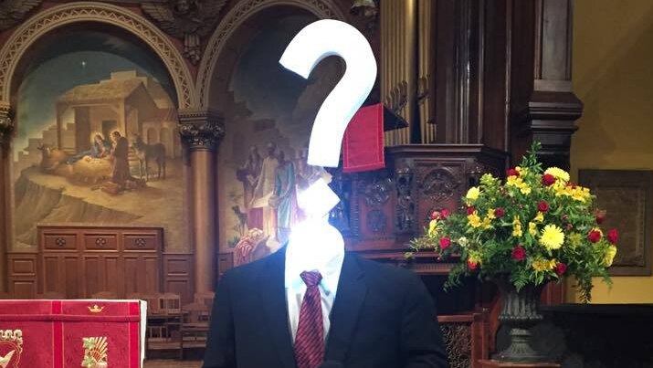 A mannequin with a question mark for a head representing the absent Sen. Toomey at a community meeting about repealing Obamacare