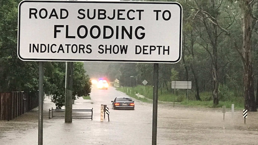 Car stranded in flood waters