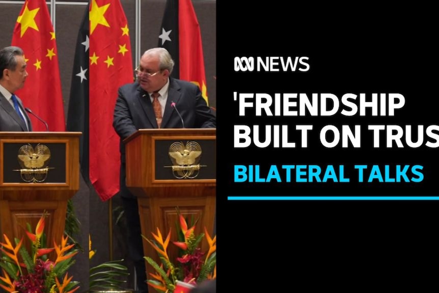 'Friendship Built on Trust', Bilateral Talks: Diplomats from China and Papua New Guinea speak at lecturns.