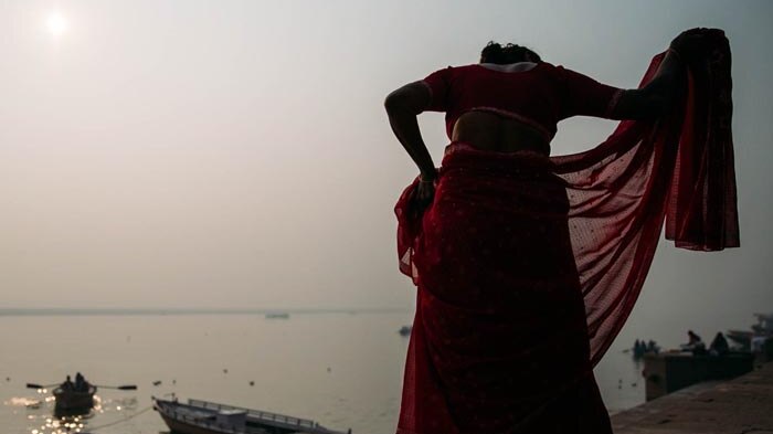 Woman by a river in India