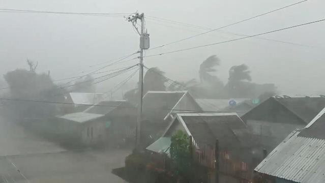 Photo shows winds and rain overcoming many homes with grey skies