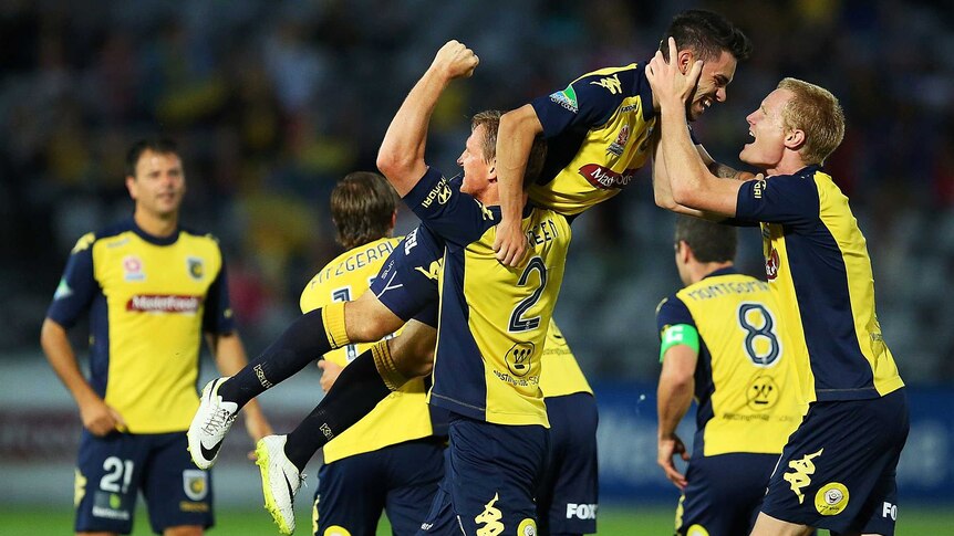 Central Coast Mariners celebrate a goal against Jets