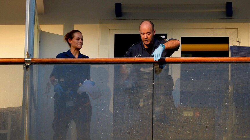 Police check for fingerprints on Carnival Spirit.