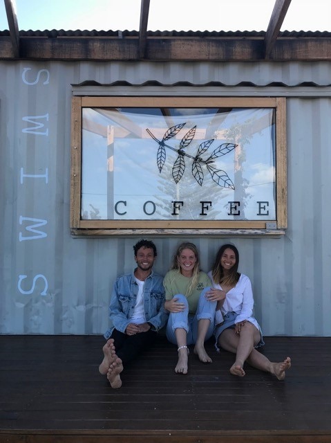 Sean Bradley, Grace Andrewartha and Caitlin Sherrey-Dadd outside the cafe in Scamander