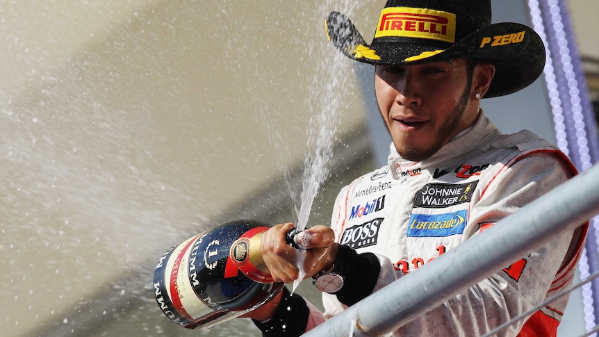 Big Texan win ... McLaren's Lewis Hamilton celebrates his US Grand Prix victory.