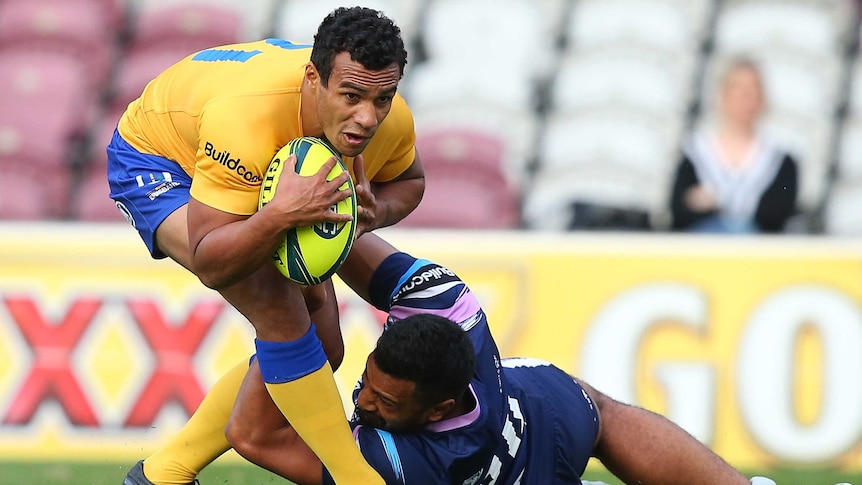 Injury return ... Will Genia is tackled by the Rising