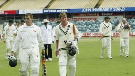 Heath Streak and Ray Price leave the field