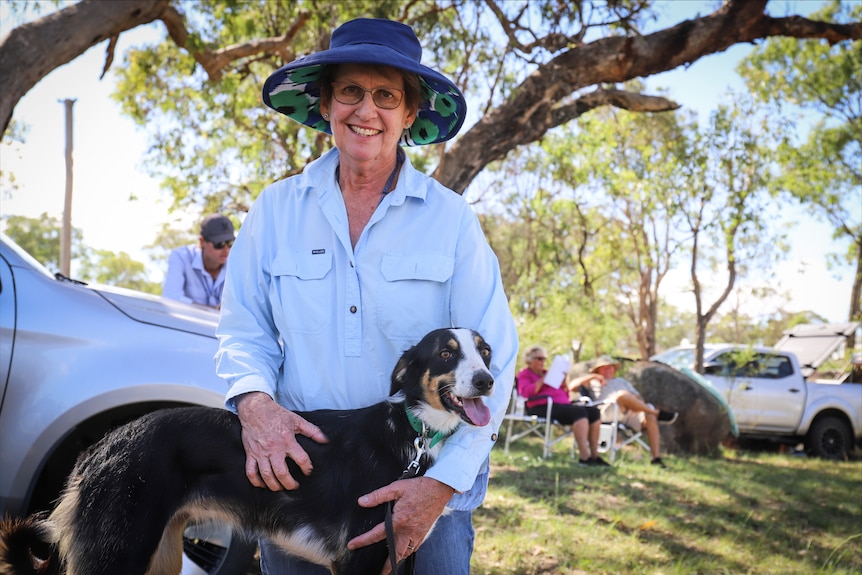 woman holding dog