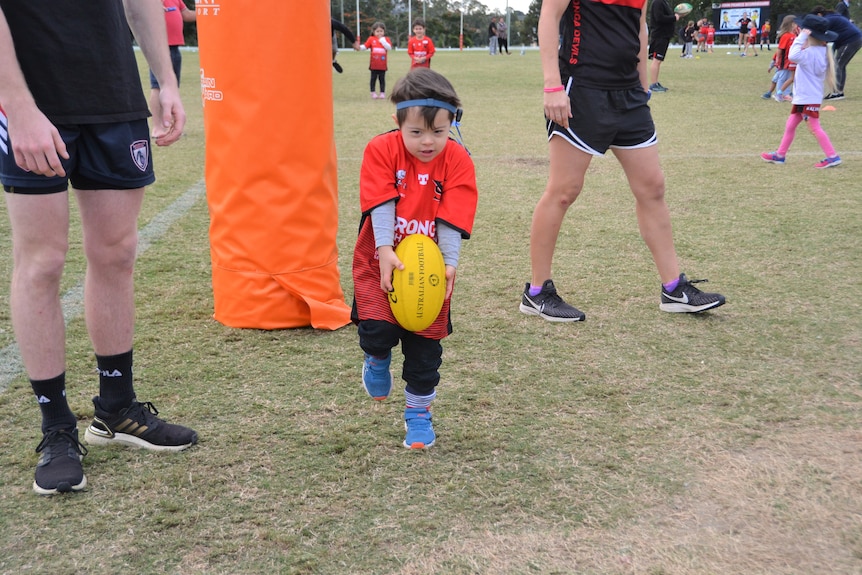 One of the youngest Auslan Aussie rules players at Yeronga South Brisbane Devils AFL club
