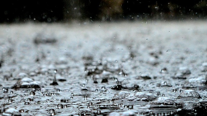 Raindrops hitting surface.