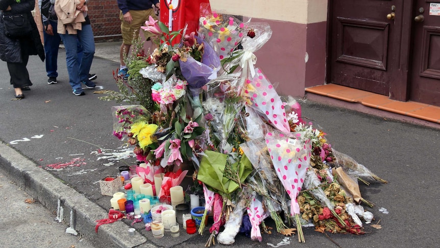 Roadside tribute to woman killed after a crash involving an allegedly stolen car.