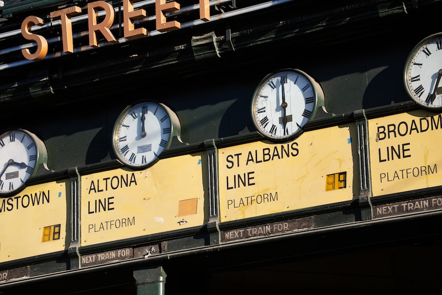 The Altona Line clock at Flinders Street station is shown stuck at a permanent midnight.