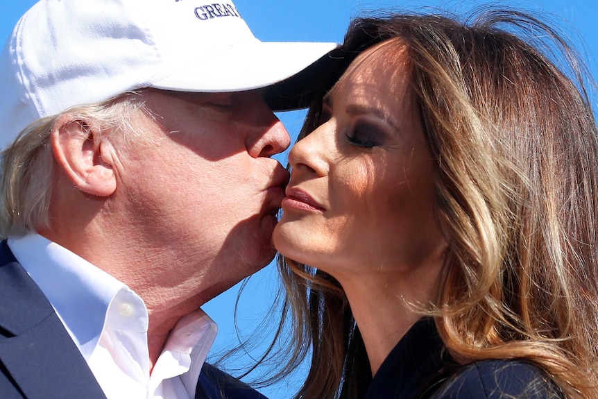 Republican presidential nominee Donald Trump kisses his wife Melania Trump