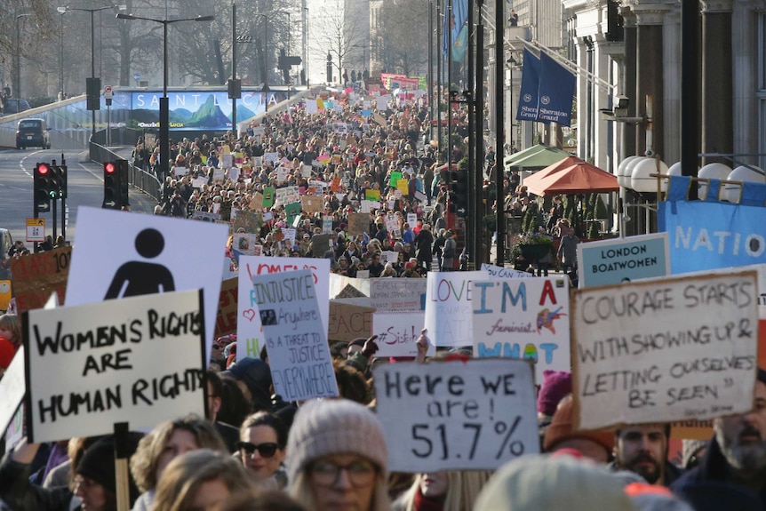 Demonstrators take part in the Women's March on London