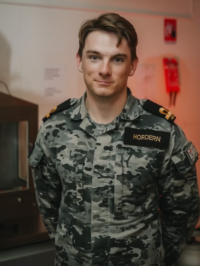 Man wearing a Royal Australian Navy uniform. 