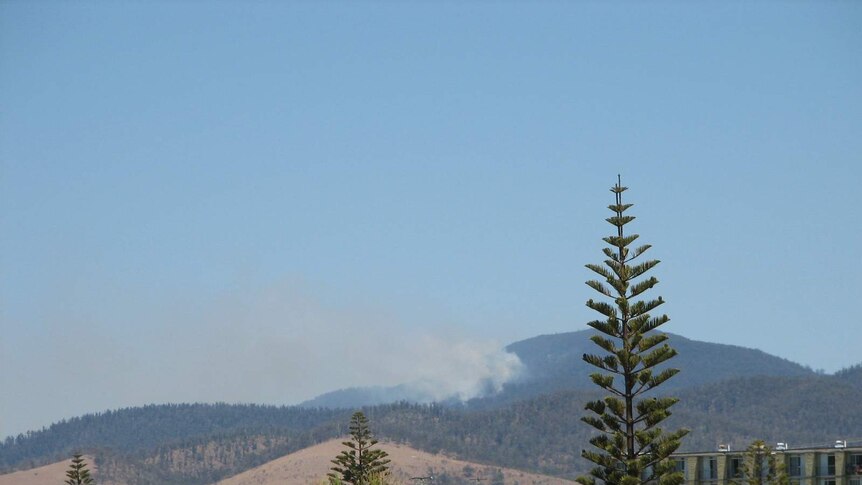 The bushfire is burning in the hills above Four Mile Creek