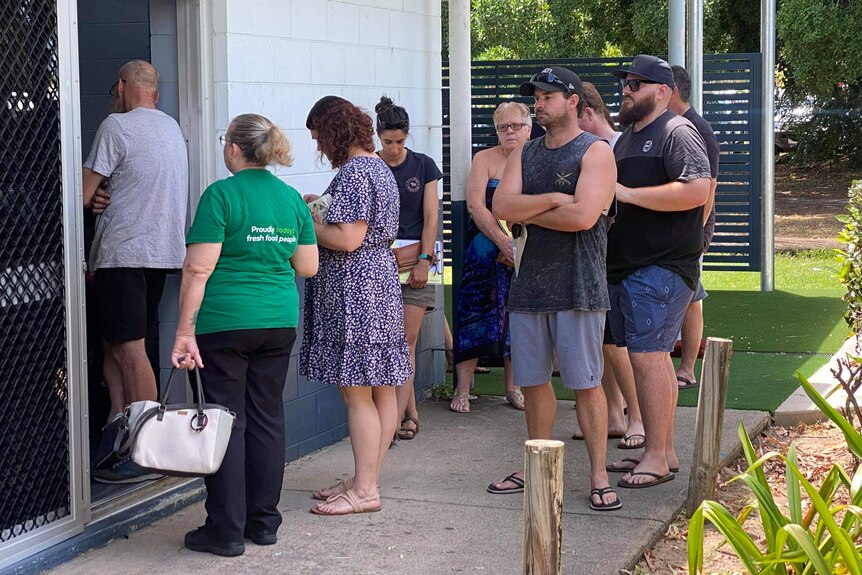 People queue for COVID-19 vaccination at Pioneer State High School.