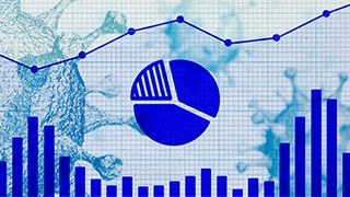 An illustration of the coronavirus, overlaid with illustrative charts.