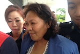 Maria Elvira Pinto Exposto leaving court in Kuala Lumpur