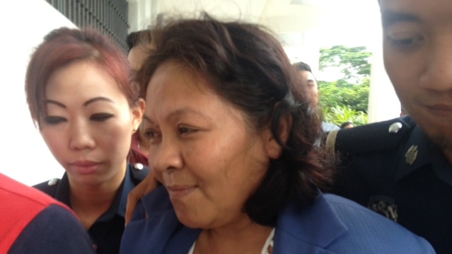 Maria Elvira Pinto Exposto leaving court in Kuala Lumpur