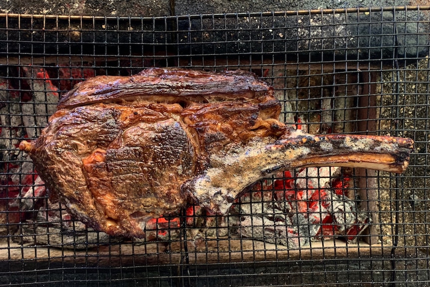A cut of beef on a grill