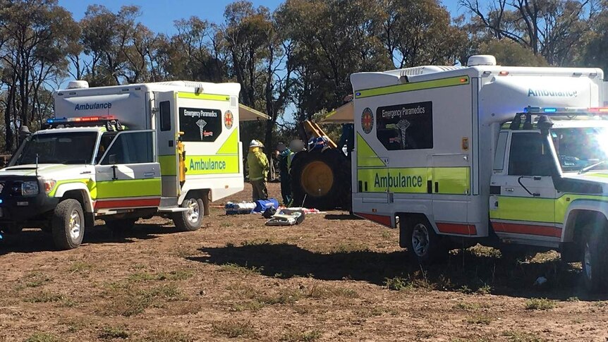 Paramedics at the scene of the farm accident where Ned Desbrow's leg was amputated.