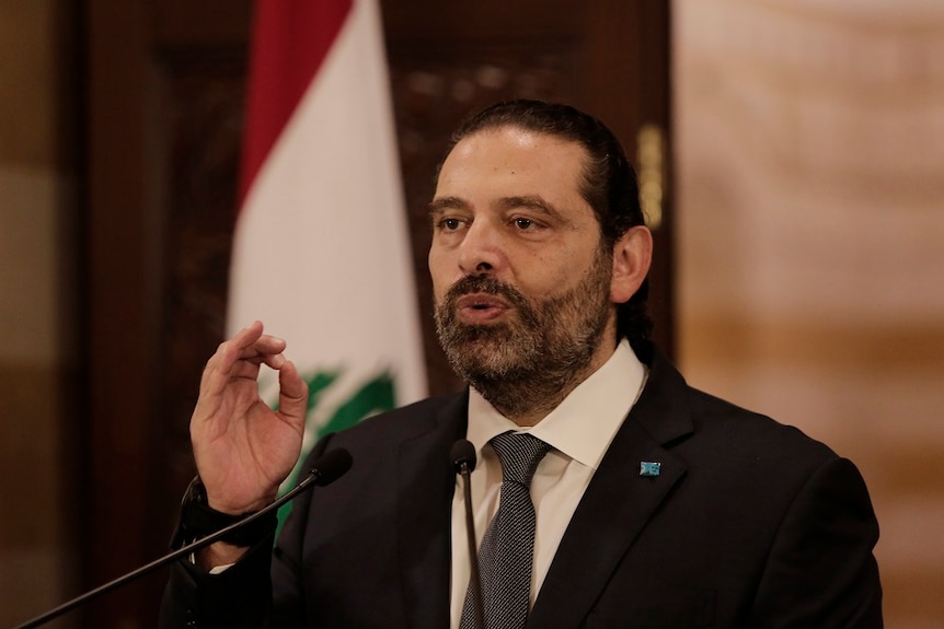Lebanon's prime minister speaking into a microphone.