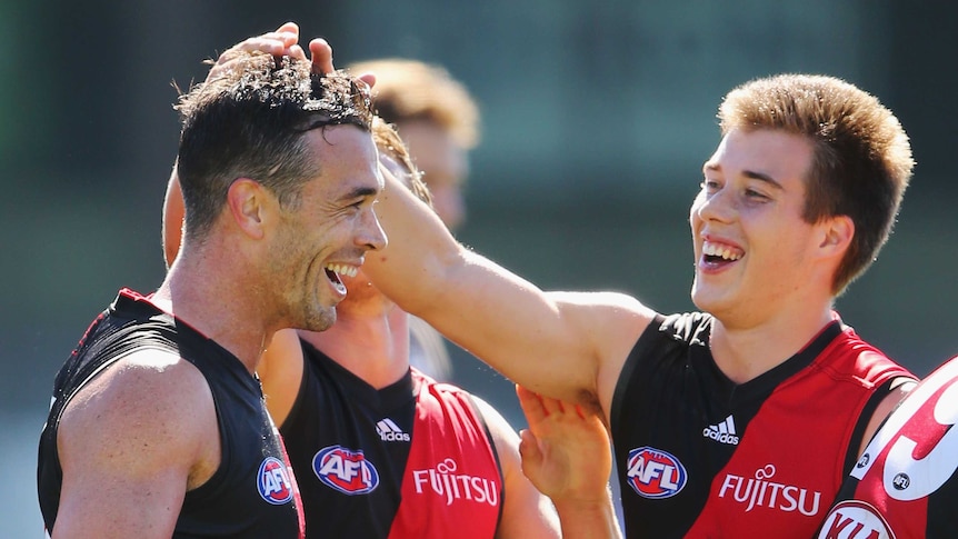 Ryan Crowley all smiles during his first run with the Essendon Bombers