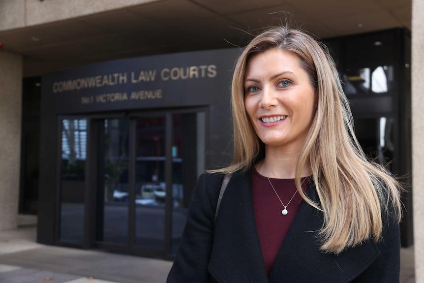 Shannon Ruddock standing outside the courthouse.