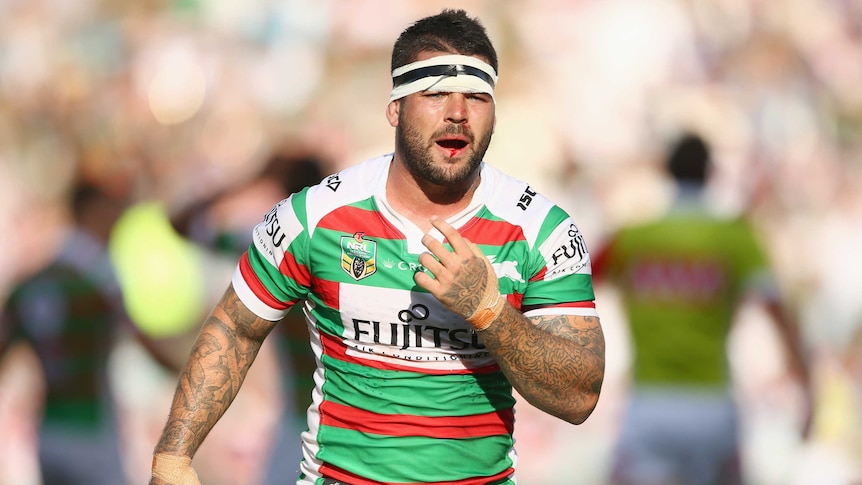 Rabbitohs' Adam Reynolds looks to bench after taking heavy hit to the jaw against Sydney Roosters.
