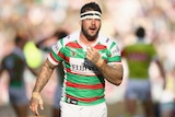 Rabbitohs' Adam Reynolds looks to bench after taking heavy hit to the jaw against Sydney Roosters.