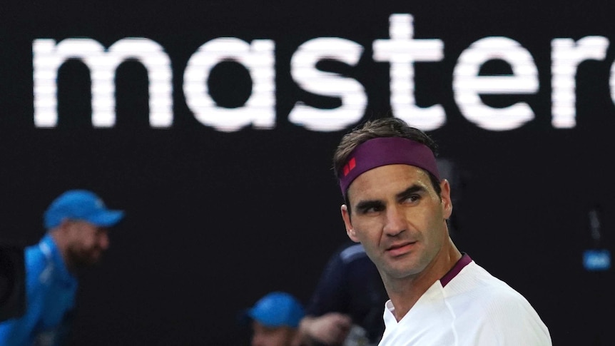 Roger Federer looks to the side during his Australian Open quarter-final against Tennys Sandgren. The word "master" is above him