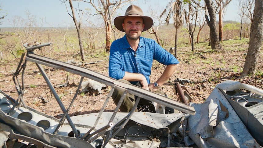 Duncan Williams sits at an RAAF Spitfire crash site, November 2019.