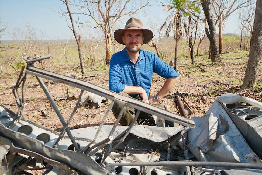 Duncan Williams sits at an RAAF Spitfire crash site, November 2019.