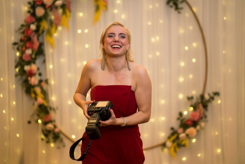 Anna Hitchings wears a red dress at the Campion Ball.