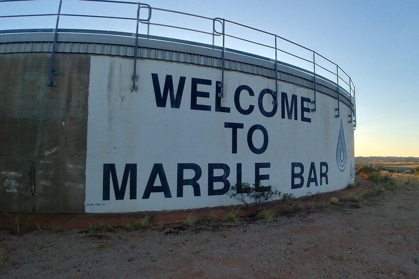 A water tank with sign saying 'WELCOME TO MARBLE BAR'