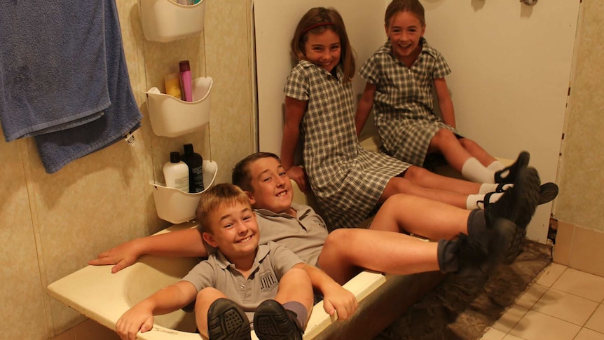 The Draper children pictured in their bathtub in Mendooran.