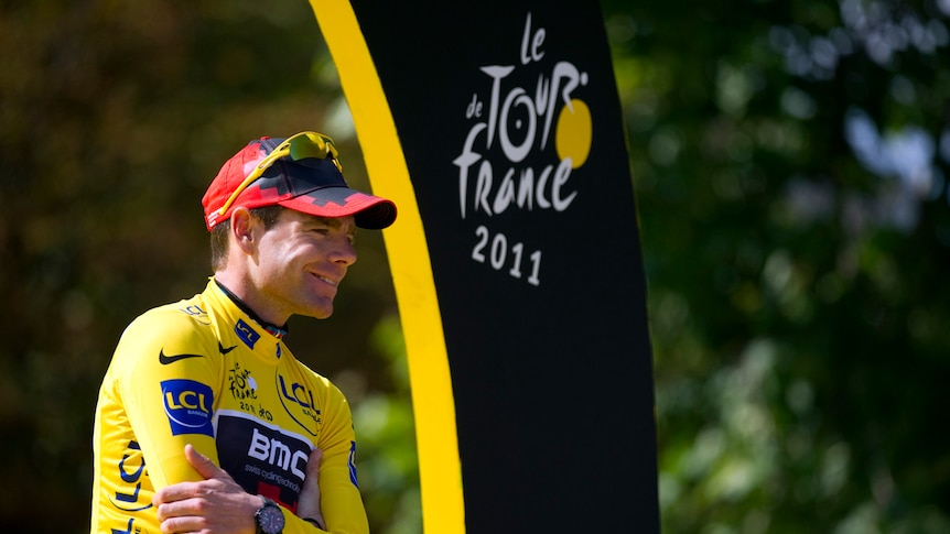 Australia's Cadel Evans celebrates on the podium on the famous Champs-Elysees.