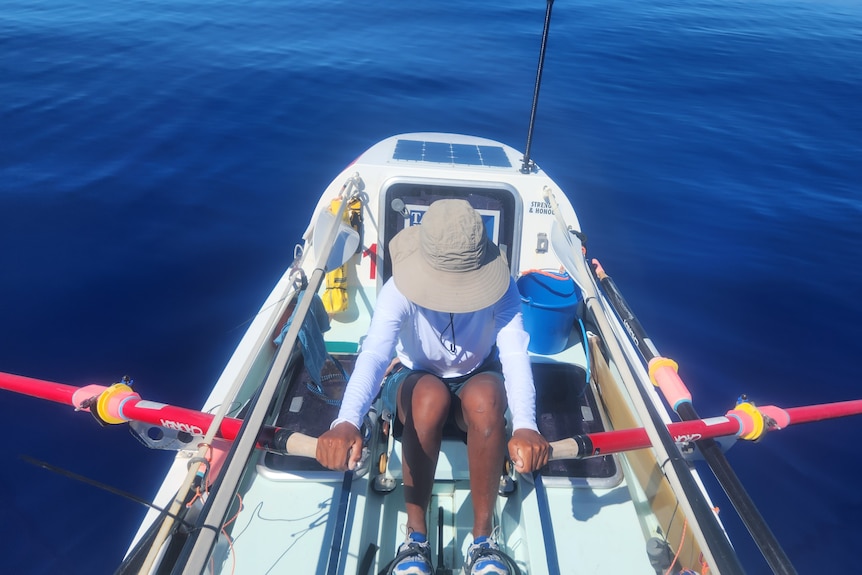 A rower in a boat on the ocean