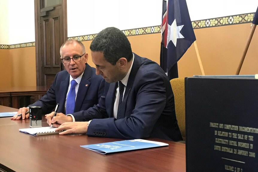 SA Premier Jay Weatherill and Treasurer Tom Koutsantonis sign a contract to buy a power plant