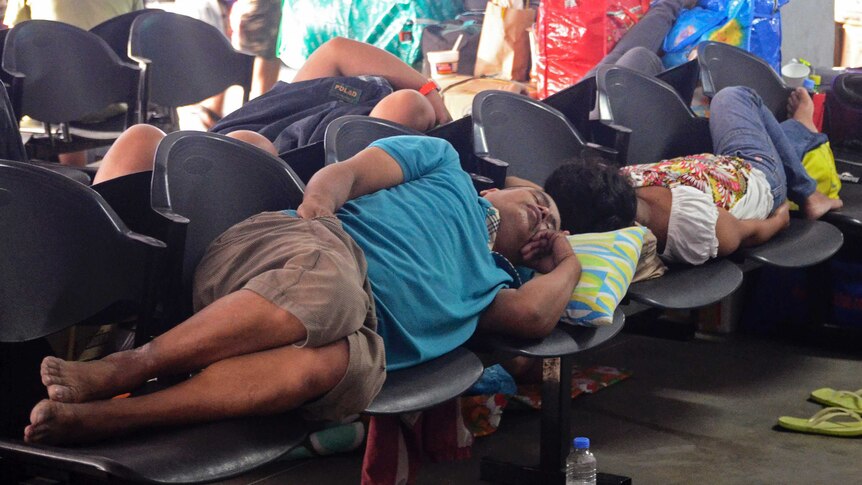 Stranded ferry passengers ahead of Typhoon Hagupit