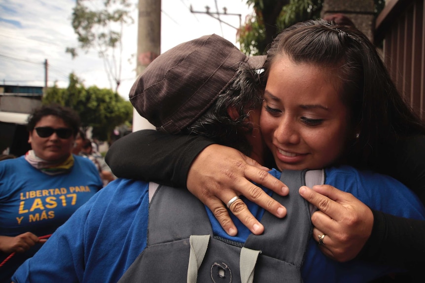 Evelyn Hernandez is hugged by a woman outside of the courthouse after being acquitted.