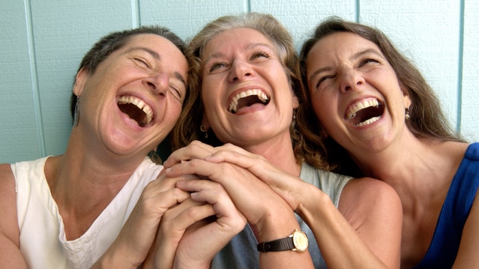 A group of smiling middle aged women