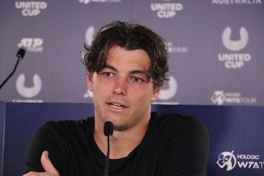 Taylor Fritz answers journalists questions at a media conference.