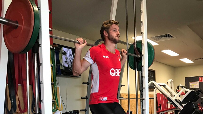 Alex Johnson trains in the gym at the Sydney Swans in 2017.