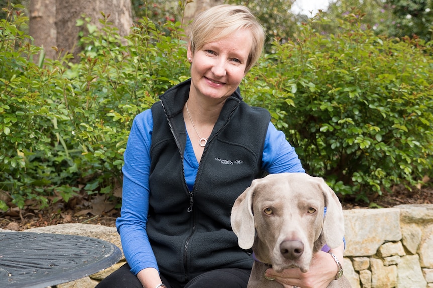 Dymphna Halls-Smith relaxes at home with her weimaraner Gemma.