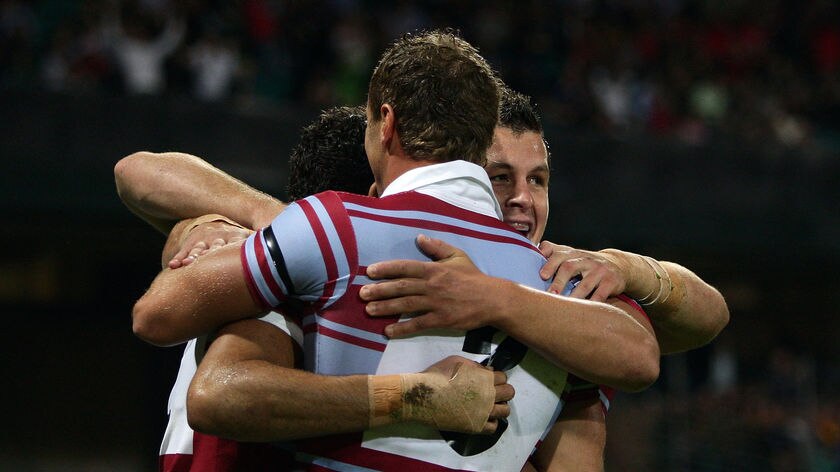 Centenary honours: Mark Gasnier celebrates with team-mates following a try in the first half.