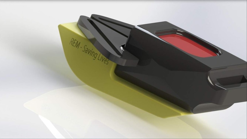 A 3D digital image of the REM device, showing its yellow plastic base attached to a seat belt.
